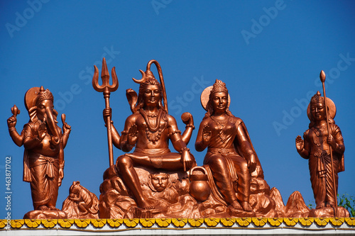 Indian God Shiva parvati and family statue with sky wide image photo