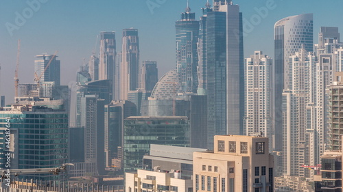Dubai skyscrapers at morning in business bay district after sunrise timelapse.