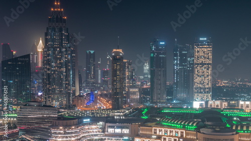 Aerial view of Dubai International Financial Centre DIFC district all night timelapse