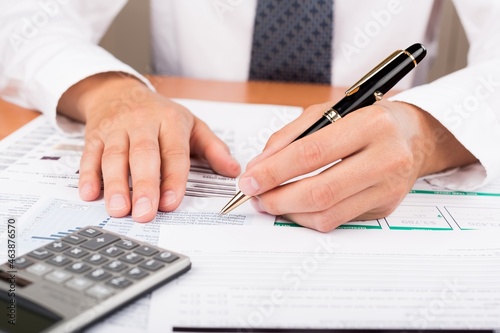 Close-up of a Businessman Analyzing Financial Figures