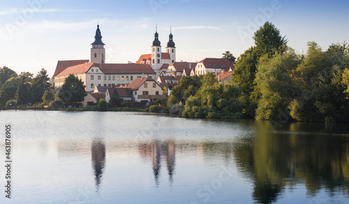 View of Telc city Panorama with blue sky seen from the surrounding river. The historic center of Telc in southern Moravia, Czech Republic, is a UNESCO World Heritage Site.