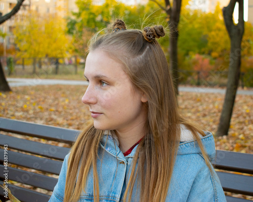woman sitting on a bench in the park