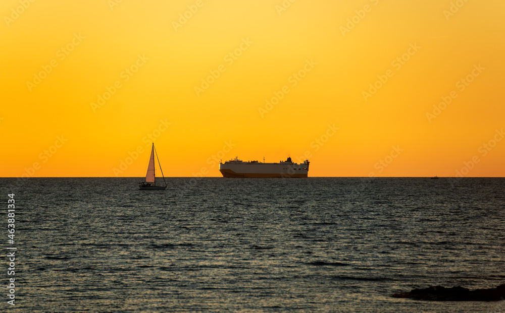 A transport ship at sunset