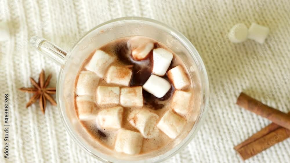 Top view dropping marshmallow in cup of cocoa. Christmas hot drinks Top view dropping marshmallow in cup of cocoa. Christmas hot drinks