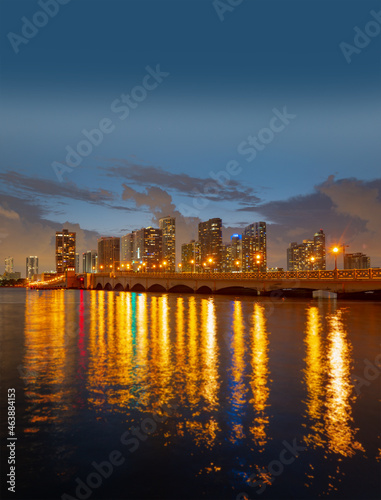 City of Miami Florida, sunset panorama with business and residential buildings and bridge on Biscayne Bay. Skyline night view.