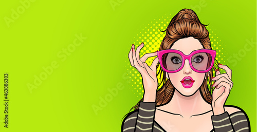 Amazed young woman in glasses look wow surprised somthing