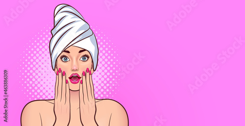 Beautiful woman in towel with clean fresh skin touch own face