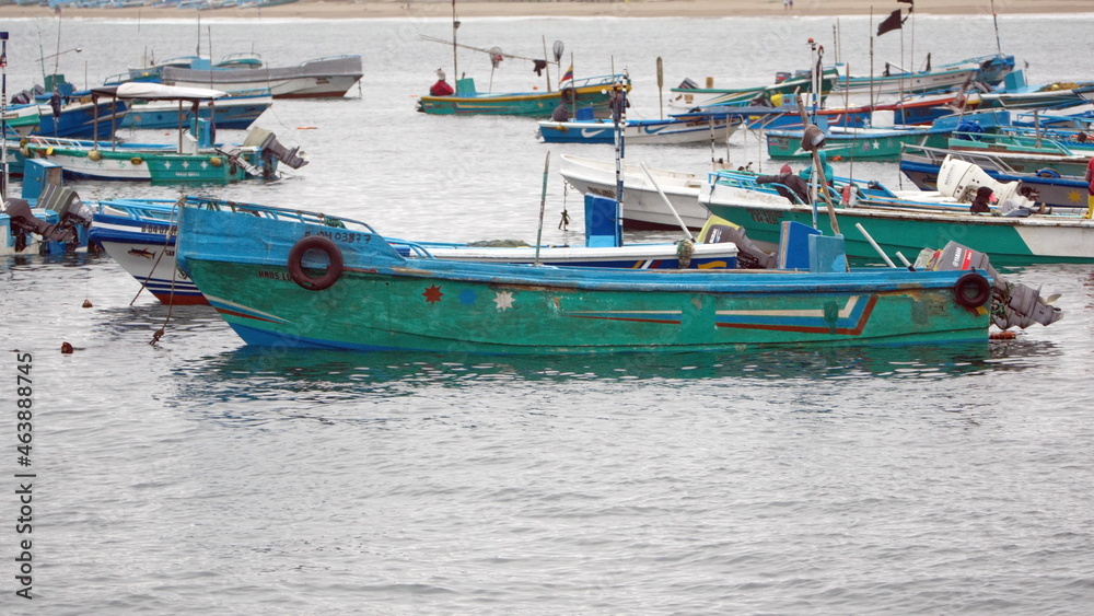 Fototapeta premium Fishing boats moored in the harbor in Puerto Lopez, Ecuador