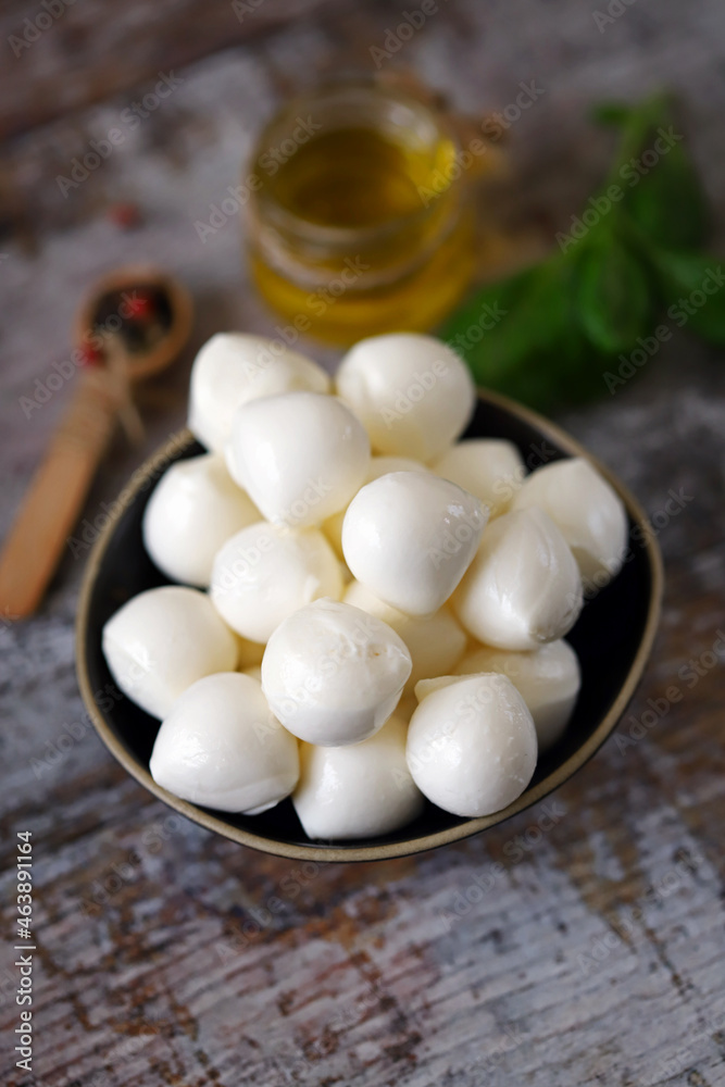 Selective focus. Mozzarella balls in a bowl. Selective focus. Mozzarella balls in a bowl.