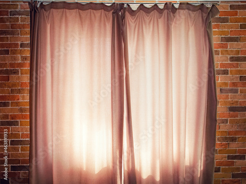 Obraz na płótnie Window with closed beige curtains in the loft room close up w salonie