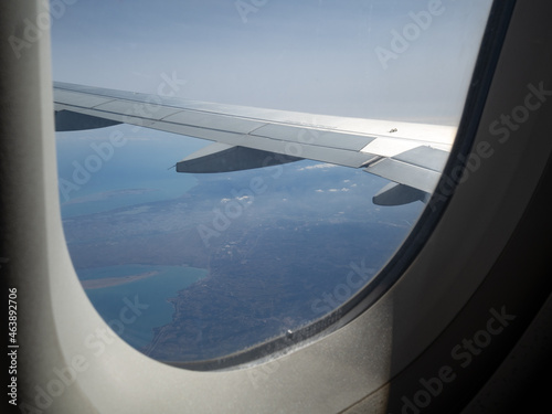 Views of the clouds from the window of an airplane. Concept: airlines, plane travel