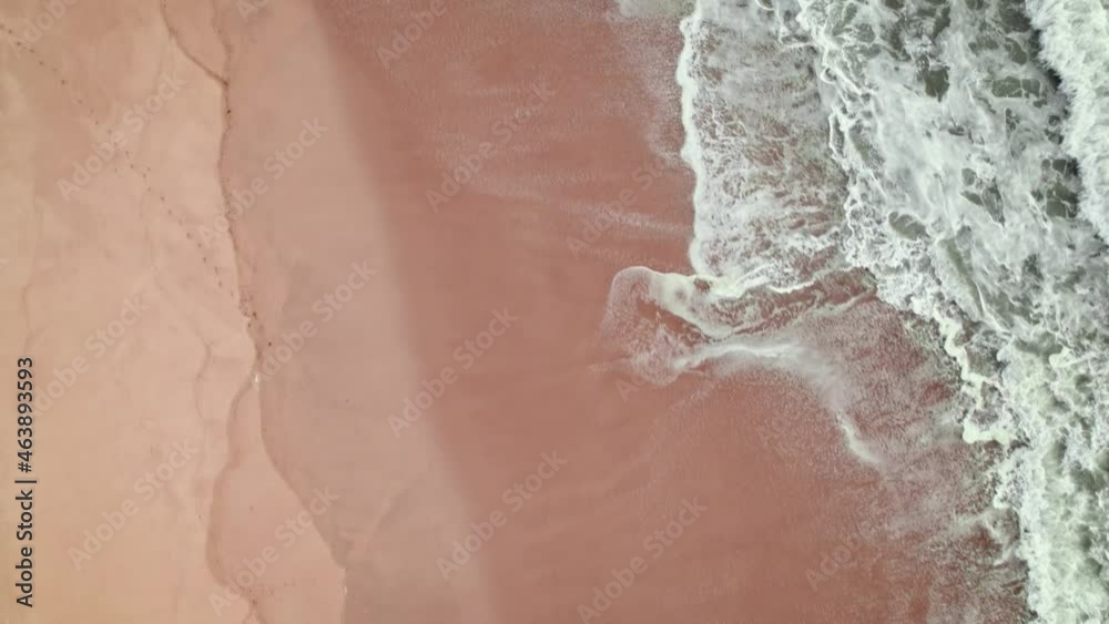 Waves of the sea from above in 4K. Aerial view of a coastal city with sandy beaches and holiday homes in Portugal. Praia de Quiaios, Portugal - sandy beach popular for surfing, bodyboarding. Waves of the sea from above in 4K. Aerial view of a coastal city with sandy beaches and holiday homes in Portugal. Praia de Quiaios, Portugal - sandy beach popular for surfing, bodyboarding.