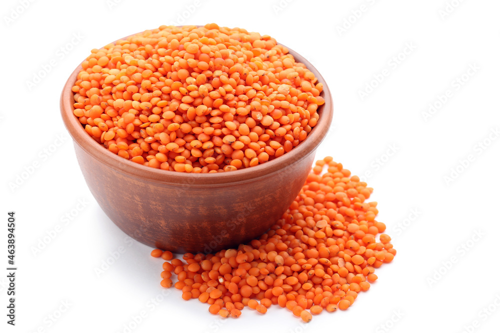 Red lentils with bowl isolated on white background Red lentils with bowl isolated on white background