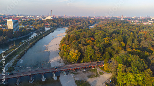 Aerial views of autumn in Munich. Isar river seen from above with colorful trees nearby photo