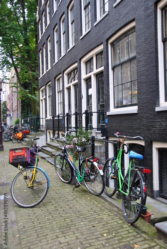 Urban retro bicycle, service and Bicycle rental. Bicycles in Amsterdam on the background of the canals. center of amsterdam. Netherlands. © YuYuPHOTO