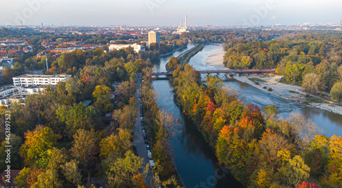 Aerial views of autumn in Munich. Isar river seen from above with colorful trees nearby © Pablo