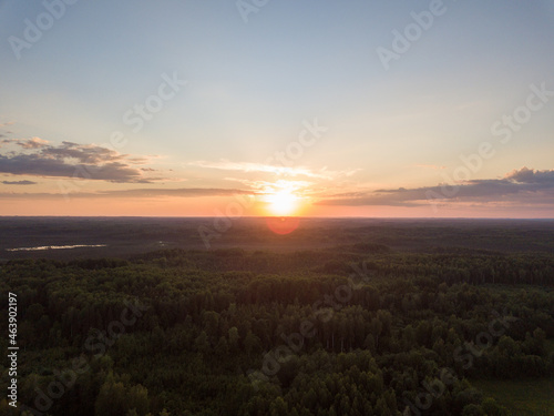 countryside fields and forests in sunset