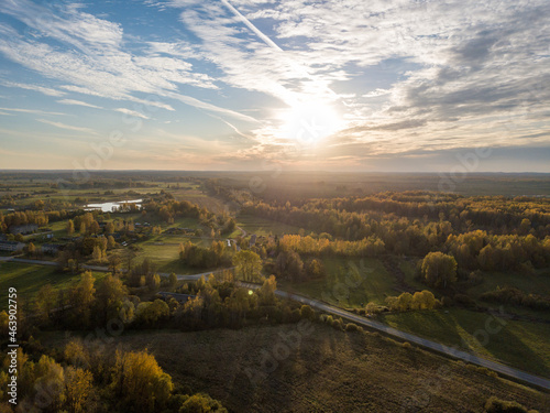 countryside fields and forests in sunset