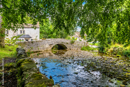 A view along Malham Beck at Malham, Yorkshire in summertime photo