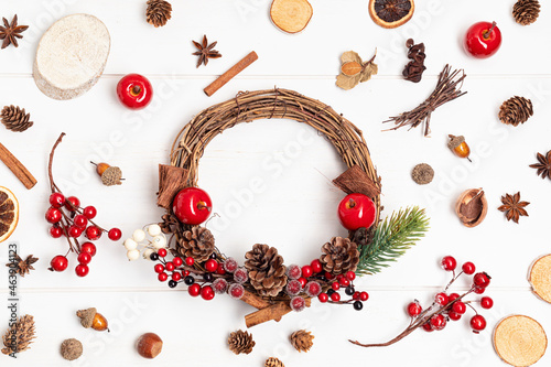 Top view of traditional handmade diy Christmas wreath made with natural elements. Winter holidays and Christmas celebration concept