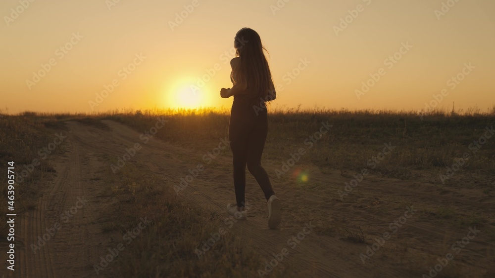 girl running at sunset on the field, morning jogging of healthy lifestyle at dawn, cardio load increasing heart rate, time to dream, fitness training generation z, triathlon marathon treadmill runner