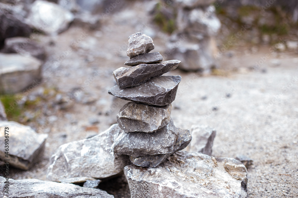 Pyramid of grey stones for meditation on forest background Pyramid of grey stones for meditation on forest background