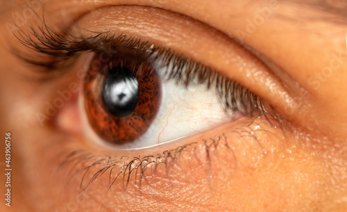 Macro photo of brown skinned man with brown eyes.