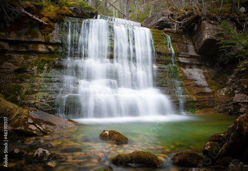 Fototapeta Naklejka Na Ścianę i Meble -  Silky waterfall in the mystical green forest