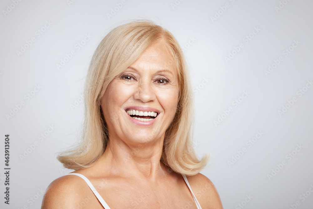 Portrait of beautiful blond senior woman posing and looking away. Beauty photography Portrait of beautiful blond senior woman posing and looking away. Beauty photography