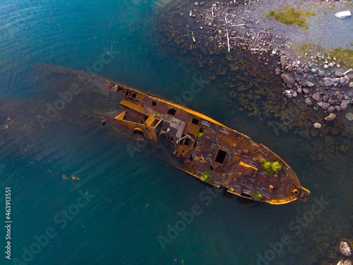 Rusty shipwreck near shore © Bailey Parsons