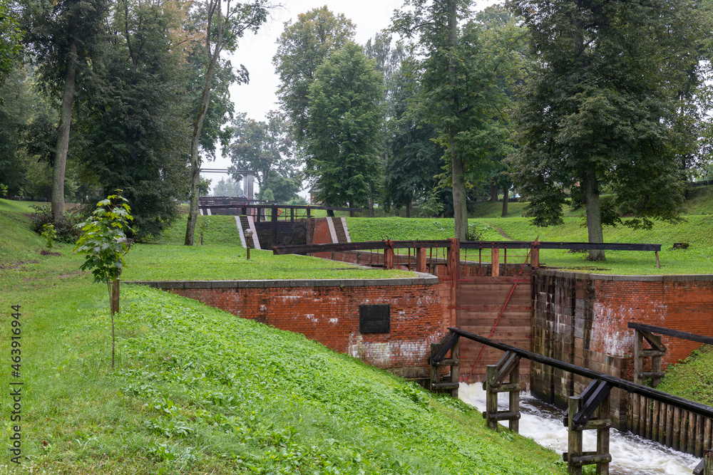 Old navigable river lock of the 20th century with mechanical control. Augustow Canal, Belarus
