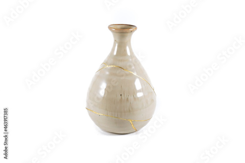 Antique Japanese Kintsugi, beige Kintsugi vase restored with gold cracks. Wabisabi pottery