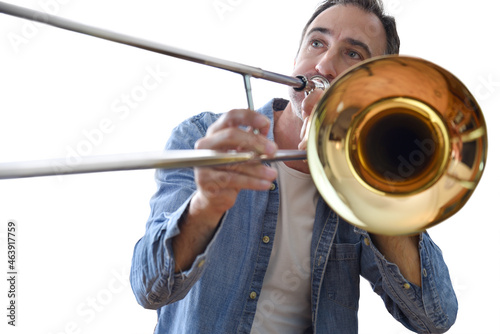 Detail of man playing trombone with white isolated background photo