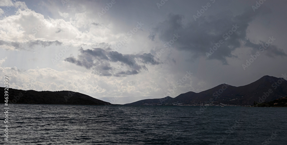 panoramic view of the village of Plaka on the island of Crete before the rain on a cloudy day, horizontal. panoramic view of the village of Plaka on the island of Crete before the rain on a cloudy day, horizontal.
