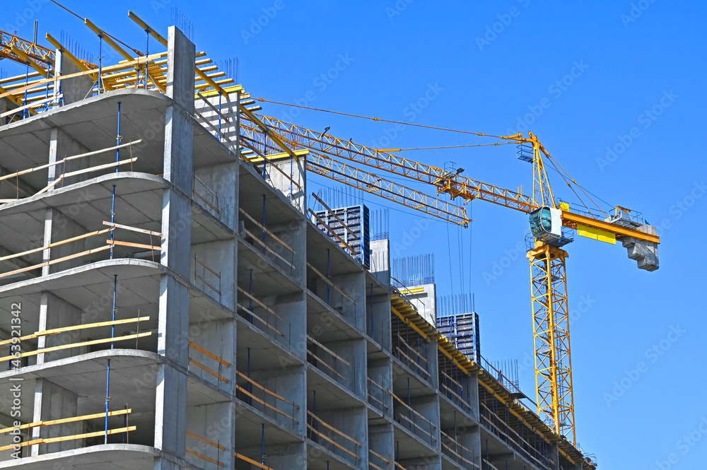 Crane and highrise construction site