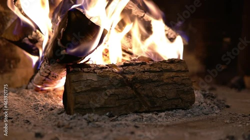 Firewood burning in the fireplace. A blazing fire inside the stove. Beautiful burning of palen photo