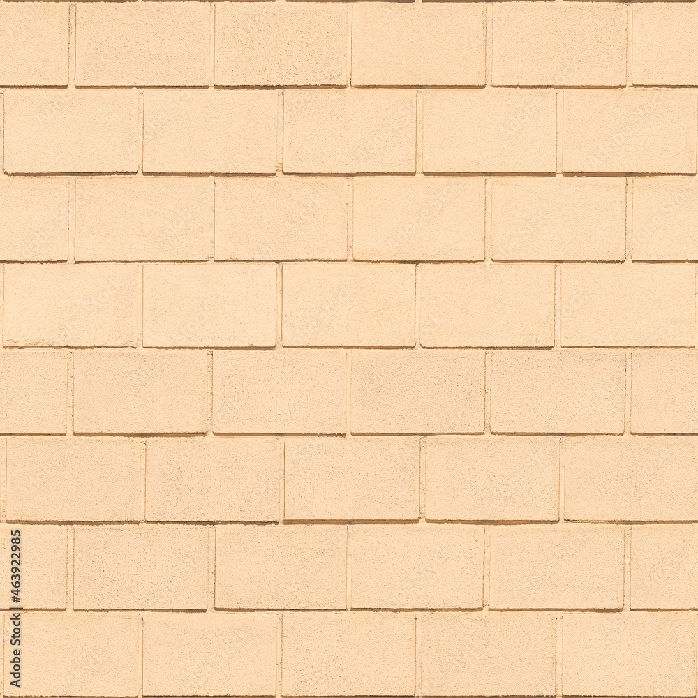 Obraz premium Concrete block wall painted with light peach-orange paint. Seamless pattern. Brickwall background.