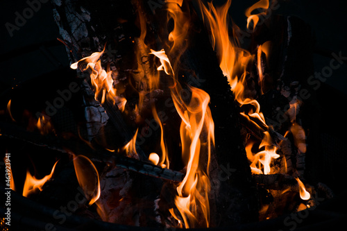 Close up of fire flames and logs in a bonfire. 