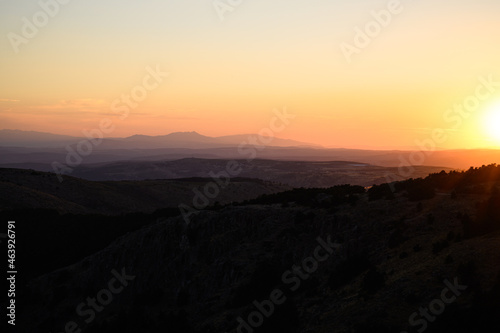 Beautiful silhouette of mountains during sunset © Claudio