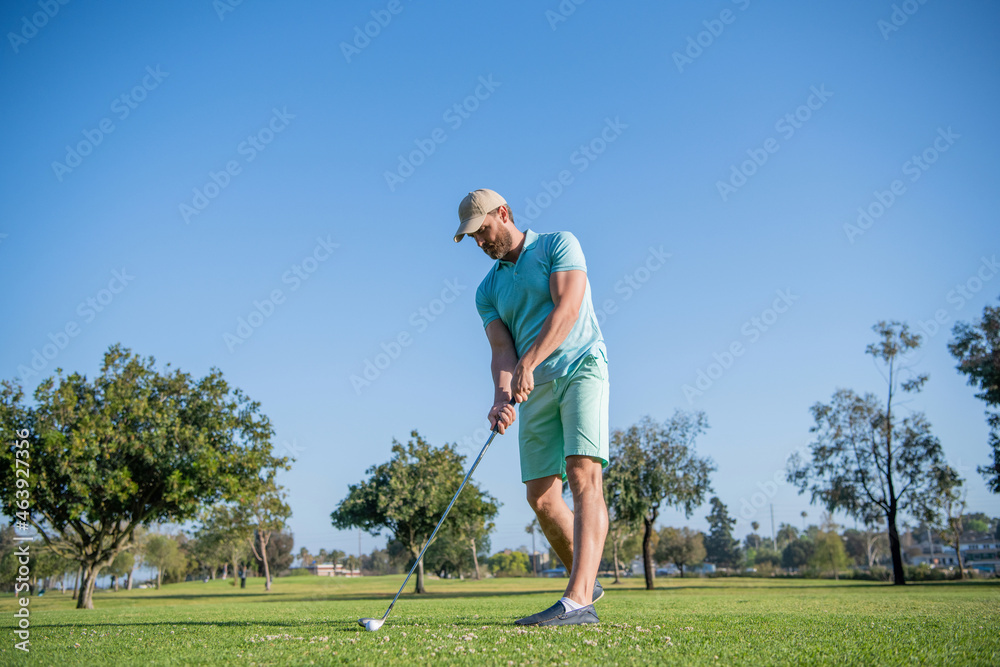 full length man playing golf game on green grass, sport