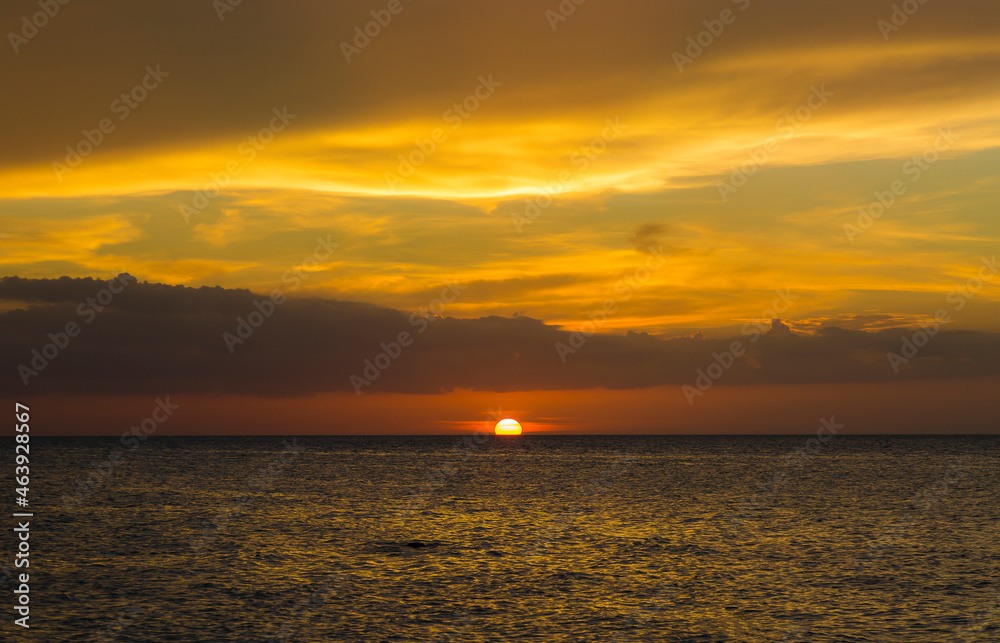 Beautiful sunset in red and orange tones on the shore of the beautiful and quiet Holbox beach in Quintana Roo, Mexico. Beautiful sunset in red and orange tones on the shore of the beautiful and quiet Holbox beach in Quintana Roo, Mexico.