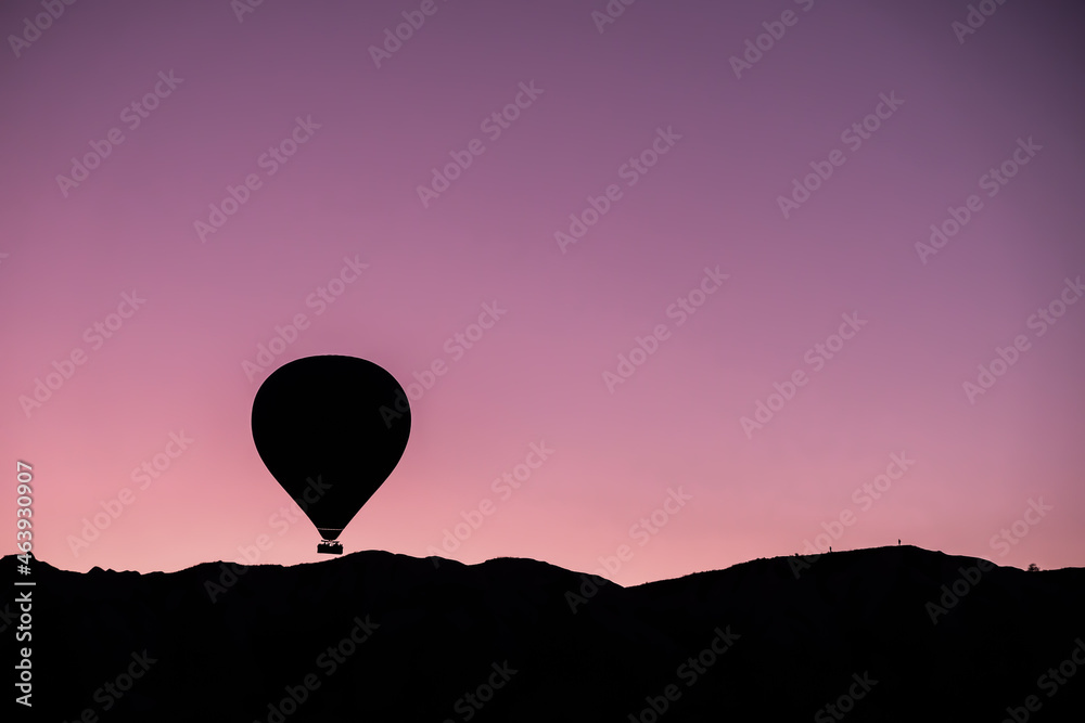 Hot air balloon flying over spectacular Cappadocia. Hot air balloon flying over spectacular Cappadocia Hot air balloon flying over spectacular Cappadocia. Hot air balloon flying over spectacular Cappadocia