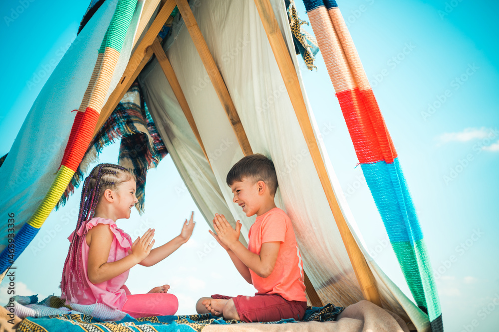 Fototapeta premium Backyard party. Happy childhood concept. Children adaptation. Summer weekend. Kids outdoor vacation.