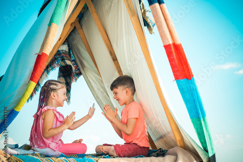 Backyard party. Happy childhood concept. Children adaptation. Summer weekend. Kids outdoor vacation. © Volodymyr