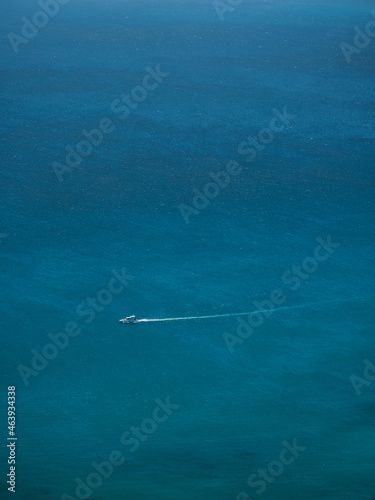 A lone boat in Atlantic ocean in Cape Town South Africa photo