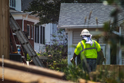 construction worker in residential neighborhood after tornado natural disaster in Georgia
