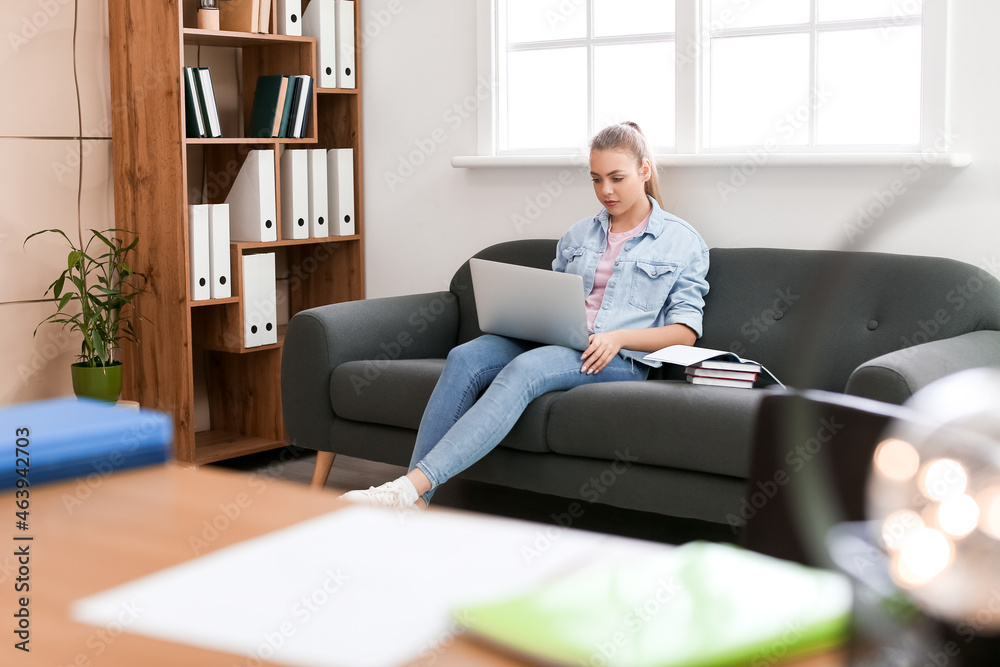 Female student preparing for exam at home