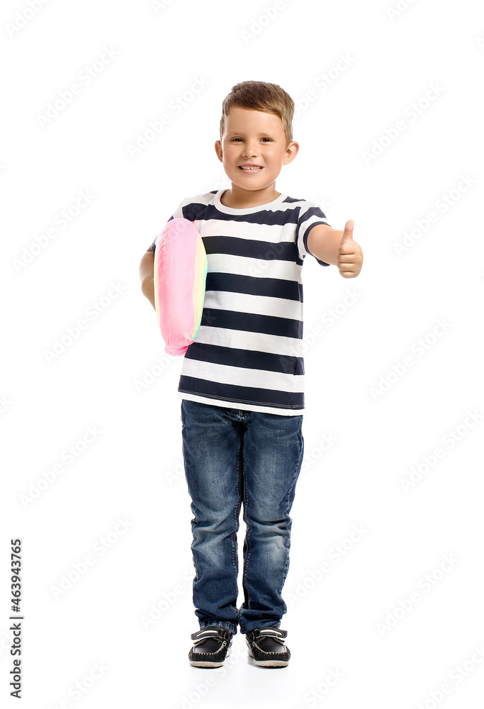 Cute little boy with toy rainbow showing thumb-up on white background Cute little boy with toy rainbow showing thumb-up on white background