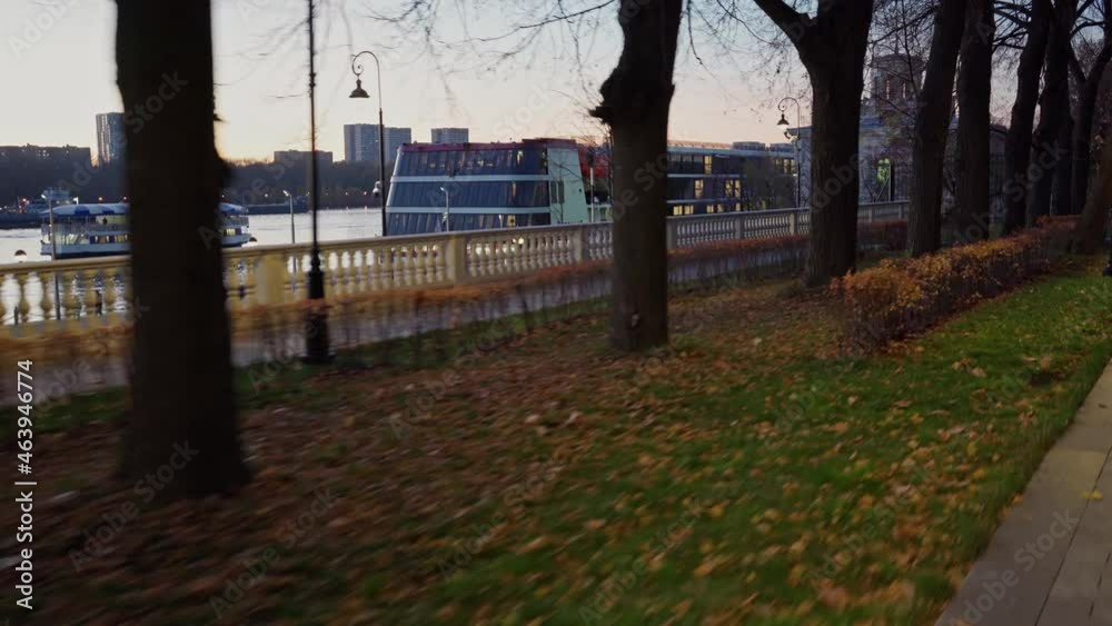 Autumn. Bike ride through the night park located on the shore near the Northern River Station of Moscow Autumn. Bike ride through the night park located on the shore near the Northern River Station of Moscow