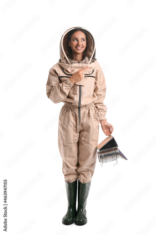 Female beekeeper pointing at something on white background Female beekeeper pointing at something on white background